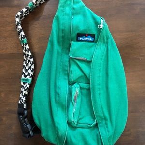 Green Kavu rope sling crossbody backpack